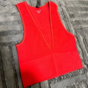 Urban Outfitters out from under tank top